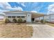 Inviting single-story home with a covered carport and neatly manicured front yard at 5619 Bayshore Rd # 164, Palmetto, FL 34221