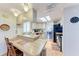 Kitchen with skylights, a breakfast bar, and modern appliances adjacent to a dining area at 5619 Bayshore Rd # 164, Palmetto, FL 34221