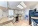 Bright kitchen with a skylight, light wood countertops, and modern appliances at 5619 Bayshore Rd # 164, Palmetto, FL 34221