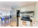 Kitchen with stainless steel refrigerator and electric range, complemented by light-colored cabinetry at 5619 Bayshore Rd # 164, Palmetto, FL 34221