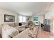 Comfortable living room featuring hardwood floors, a ceiling fan, and stylish decor at 5619 Bayshore Rd # 164, Palmetto, FL 34221