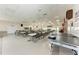 Spacious recreation room equipped with tables, chairs, and a ping pong table for group activities and entertainment at 5619 Bayshore Rd # 164, Palmetto, FL 34221