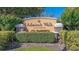 Admirals Walk community entrance with beautiful landscaping and signage at 5681 Bidwell Pkwy # 102, Sarasota, FL 34233