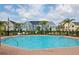 Enjoy the large community pool, palm trees, and manicured landscaping at 5681 Bidwell Pkwy # 102, Sarasota, FL 34233