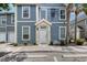 Charming condo featuring a covered entryway and well-maintained landscaping at 5681 Bidwell Pkwy # 102, Sarasota, FL 34233