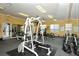 Well-equipped fitness center with multiple machines, free weights, and mirrors at 5681 Bidwell Pkwy # 102, Sarasota, FL 34233