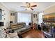 Comfortable living room with a plush couch and contemporary decor at 5681 Bidwell Pkwy # 102, Sarasota, FL 34233