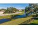 Scenic street view of a well-maintained neighborhood with mature trees and landscaping at 5681 Bidwell Pkwy # 102, Sarasota, FL 34233