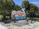 A welcoming sign to Holmes Beach on Anna Maria Island, Florida, surrounded by palm trees at 5895 17Th W St # B-26, Bradenton, FL 34207