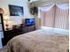 A bedroom featuring neutral walls, carpet, and decor and large window at 5895 17Th W St # B-26, Bradenton, FL 34207