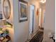 Hallway features art, decor, and access to various rooms in the home at 5895 17Th W St # B-26, Bradenton, FL 34207