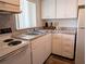 The kitchen features white appliances and granite-look laminate countertops at 5895 17Th W St # B-26, Bradenton, FL 34207