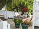 Enjoy this outdoor patio with flower pots, picnic table, and grill, perfect for gatherings and relaxation at 5895 17Th W St # B-26, Bradenton, FL 34207