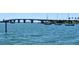 Beautiful waterfront with boats on the shimmering sea and a long, modern bridge stretching to the city skyline at 5895 17Th W St # B-26, Bradenton, FL 34207