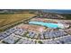 Stunning aerial view of the tropical community with a large lagoon and pristine, modern homes at 5910 Red Mangrove Ln, Bradenton, FL 34210