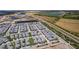 Community aerial showcasing modern homes, picturesque lakes, and convenient roadways at 5910 Red Mangrove Ln, Bradenton, FL 34210