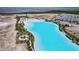 Overhead image of the crystal clear lagoon with modern residences and lush landscaping at 5910 Red Mangrove Ln, Bradenton, FL 34210
