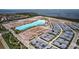 Aerial view shows a Primary-planned community with a large lagoon and modern homes at 5910 Red Mangrove Ln, Bradenton, FL 34210