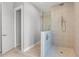 Contemporary bathroom with a walk-in shower and sleek gray and neutral finishes at 5910 Red Mangrove Ln, Bradenton, FL 34210