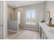 Modern bathroom showcasing a walk-in shower, double vanity, and stylish fixtures at 5910 Red Mangrove Ln, Bradenton, FL 34210