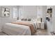 A staged bedroom with stylish decor, window shutters, and a comfortable bed at 5910 Red Mangrove Ln, Bradenton, FL 34210