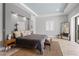 Comfortable bedroom with a king-sized bed, a large window, and stylish decor at 5910 Red Mangrove Ln, Bradenton, FL 34210