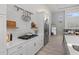 Bright kitchen featuring white subway tile, stainless steel appliances, quartz countertops, and an open floor plan at 5910 Red Mangrove Ln, Bradenton, FL 34210