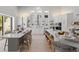 Modern kitchen with stainless steel appliances, white cabinetry, and sliding glass doors to pool at 5910 Red Mangrove Ln, Bradenton, FL 34210