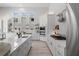 Bright open concept kitchen with a large island, quartz countertops, subway tile backsplash, and stainless appliances at 5910 Red Mangrove Ln, Bradenton, FL 34210