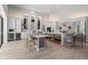 Open kitchen features stainless steel appliances and ample counter space with bar seating at 5910 Red Mangrove Ln, Bradenton, FL 34210