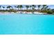 Stunning lagoon with sandy beach and palm trees offers a relaxing retreat at 5910 Red Mangrove Ln, Bradenton, FL 34210