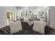 Living room area featuring a view of kitchen with stainless appliances and island seating at 5910 Red Mangrove Ln, Bradenton, FL 34210