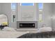 Living room with statement fireplace, neutral tones, and abundant natural light at 5910 Red Mangrove Ln, Bradenton, FL 34210