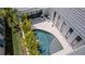 Aerial view of a backyard oasis featuring a private pool, tropical landscaping, and outdoor seating at 5910 Red Mangrove Ln, Bradenton, FL 34210