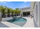 A stunning outdoor private pool features a waterfall, tiled decking, and lush tropical landscaping in this backyard oasis at 5910 Red Mangrove Ln, Bradenton, FL 34210