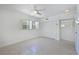 Clean bedroom with terrazzo floors, shuttered windows, and closet with shuttered doors at 5924 Gulf Of Mexico Dr, Longboat Key, FL 34228