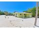 Charming single story home with a covered carport, mature landscaping and gravel driveway at 5924 Gulf Of Mexico Dr, Longboat Key, FL 34228