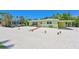Charming single story home with a covered carport and mature landscaping at 5924 Gulf Of Mexico Dr, Longboat Key, FL 34228