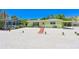Charming single story home with a covered carport and mature landscaping at 5924 Gulf Of Mexico Dr, Longboat Key, FL 34228