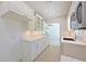 Bright kitchen featuring white cabinets and stone countertops at 5924 Gulf Of Mexico Dr, Longboat Key, FL 34228