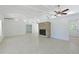 Bright living room featuring a fireplace, a beamed ceiling, and an open floorplan at 5924 Gulf Of Mexico Dr, Longboat Key, FL 34228