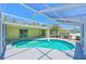 Sparkling kidney-shaped pool with screened-in lanai, perfect for outdoor entertainment at 5924 Gulf Of Mexico Dr, Longboat Key, FL 34228
