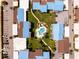 Aerial view of condos with a central pool, walking paths, and parking at 5964 7Th W Ave # 5964, Bradenton, FL 34209
