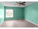 Empty, standard bedroom with window and ceiling fan at 5964 7Th W Ave # 5964, Bradenton, FL 34209