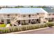 Townhouses featuring new roofing and private entrances, set along a road with greenery at 5964 7Th W Ave # 5964, Bradenton, FL 34209