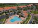 Community aerial view showcasing a sparkling swimming pool and lush landscaping at 6151 Bahia Del Mar Blvd # 123, St Petersburg, FL 33715