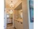 Bathroom featuring vanity and mirrors plus views of chandelier and other rooms at 6151 Bahia Del Mar Blvd # 123, St Petersburg, FL 33715