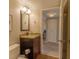 Bathroom featuring granite countertop vanity and tiled floors near closet at 6151 Bahia Del Mar Blvd # 123, St Petersburg, FL 33715
