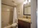 Bathroom featuring shower with tiled floors and granite countertop vanity at 6151 Bahia Del Mar Blvd # 123, St Petersburg, FL 33715
