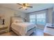 Serene bedroom featuring a comfortable queen bed and bright natural light at 6151 Bahia Del Mar Blvd # 123, St Petersburg, FL 33715